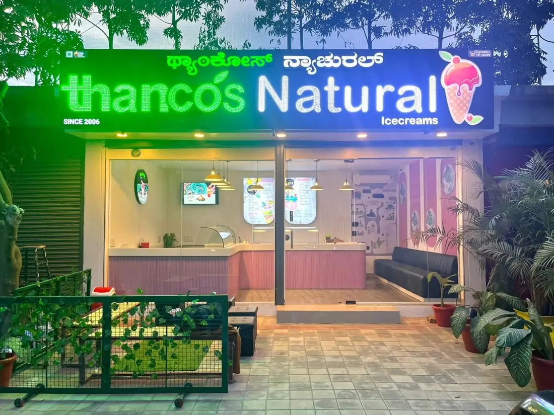 A Thanco's Natural parlour lit up at night